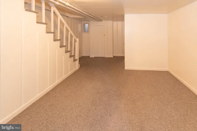 a white toilet sitting next to a white sink