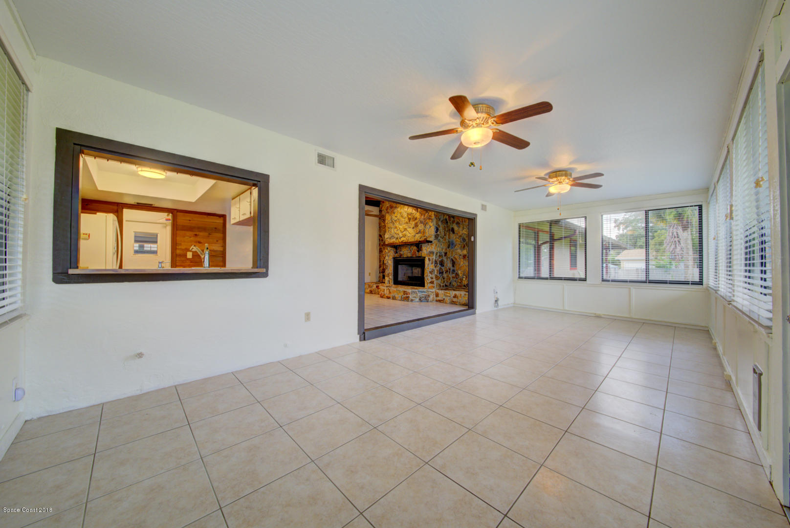 4660 Rector Road Cocoa, FL 32926 - Photo 18 of 56 Florida room with kitchen pass-thru