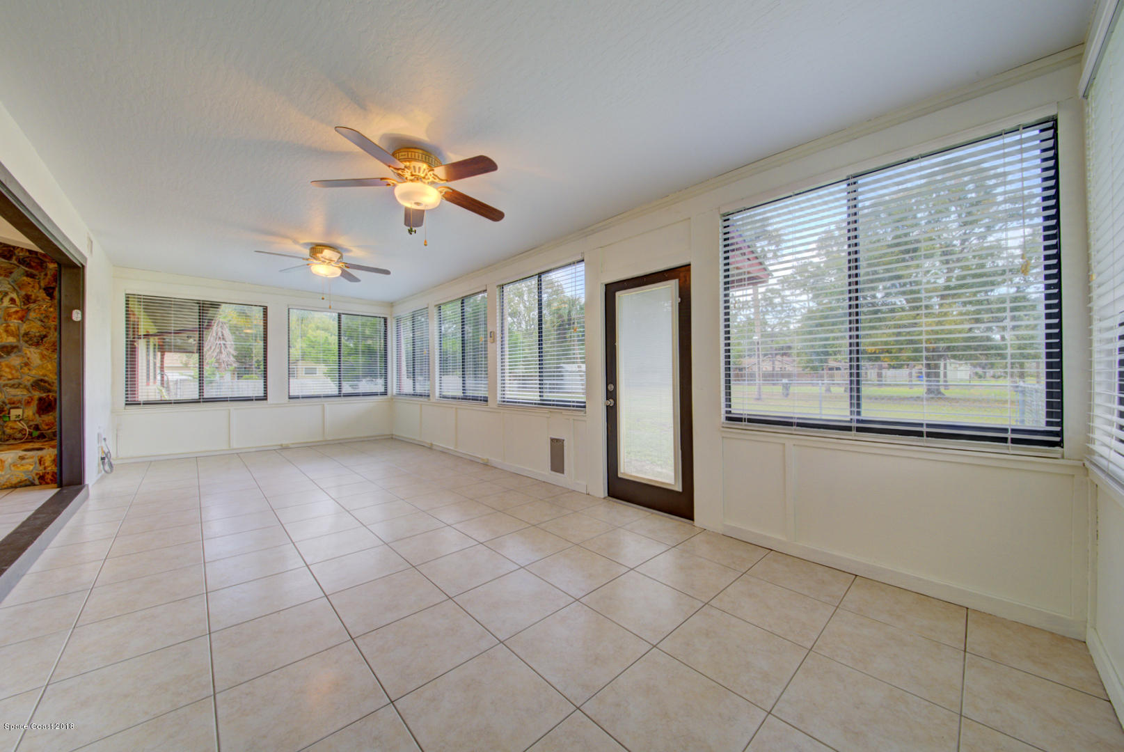 4660 Rector Road Cocoa, FL 32926 - Photo 19 of 56 Florida room with access to backyard
