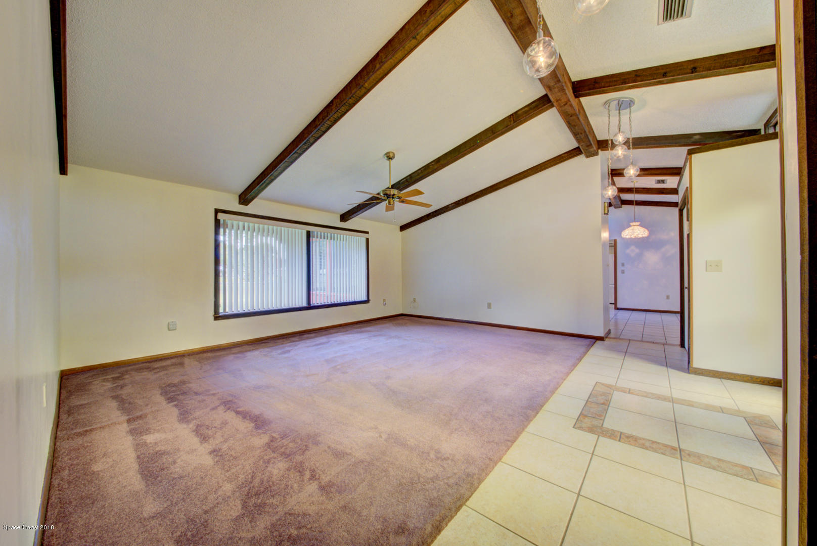4660 Rector Road Cocoa, FL 32926 - Photo 24 of 56 living room with wood beams