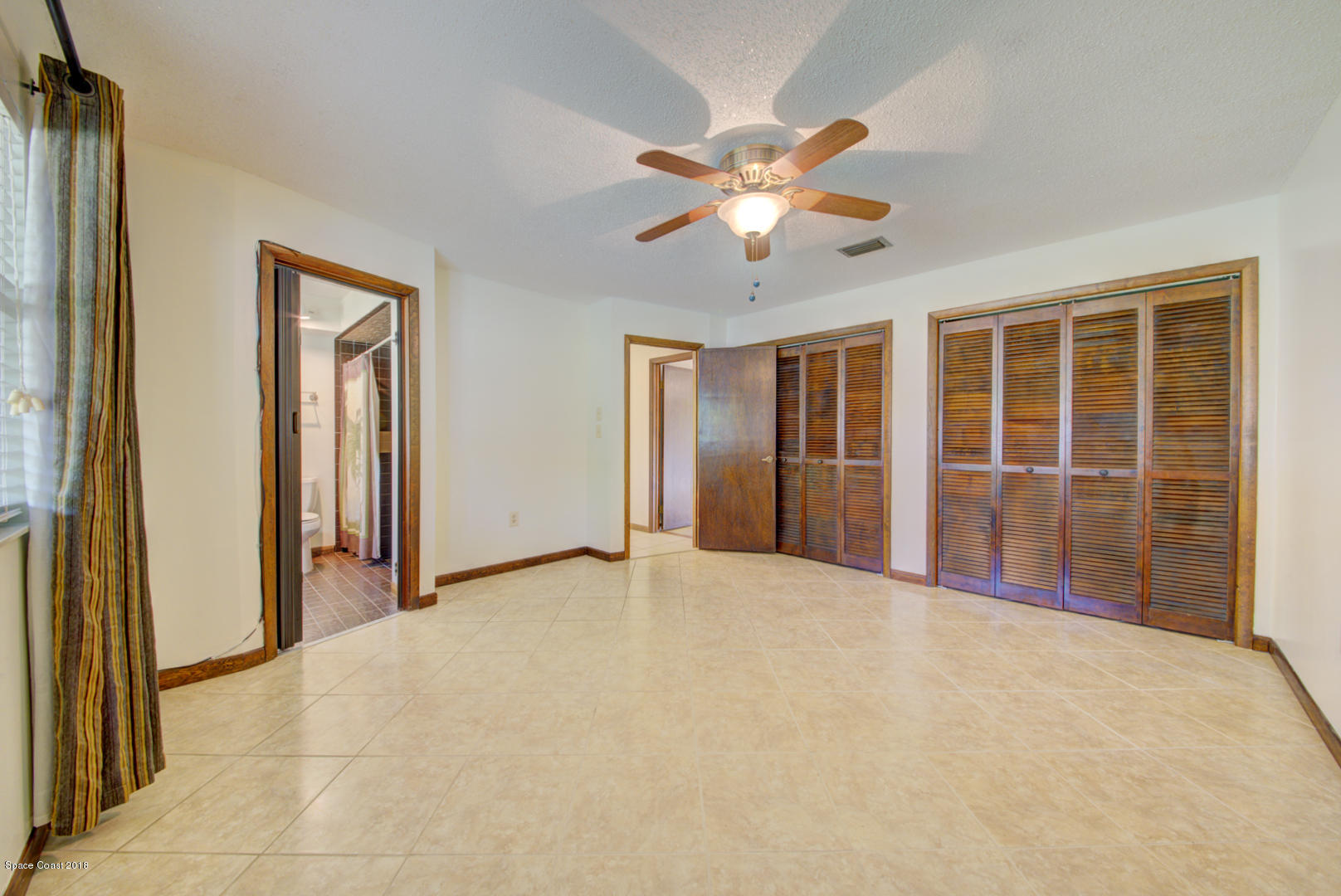 4660 Rector Road Cocoa, FL 32926 - Photo 26 of 56 master bedroom with ensuite