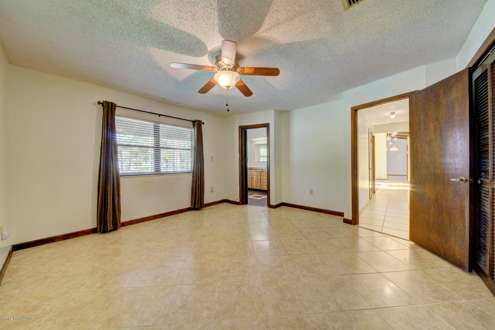 4660 Rector Road Cocoa, FL 32926 - Photo 28 of 56 master bedroom with tile floor
