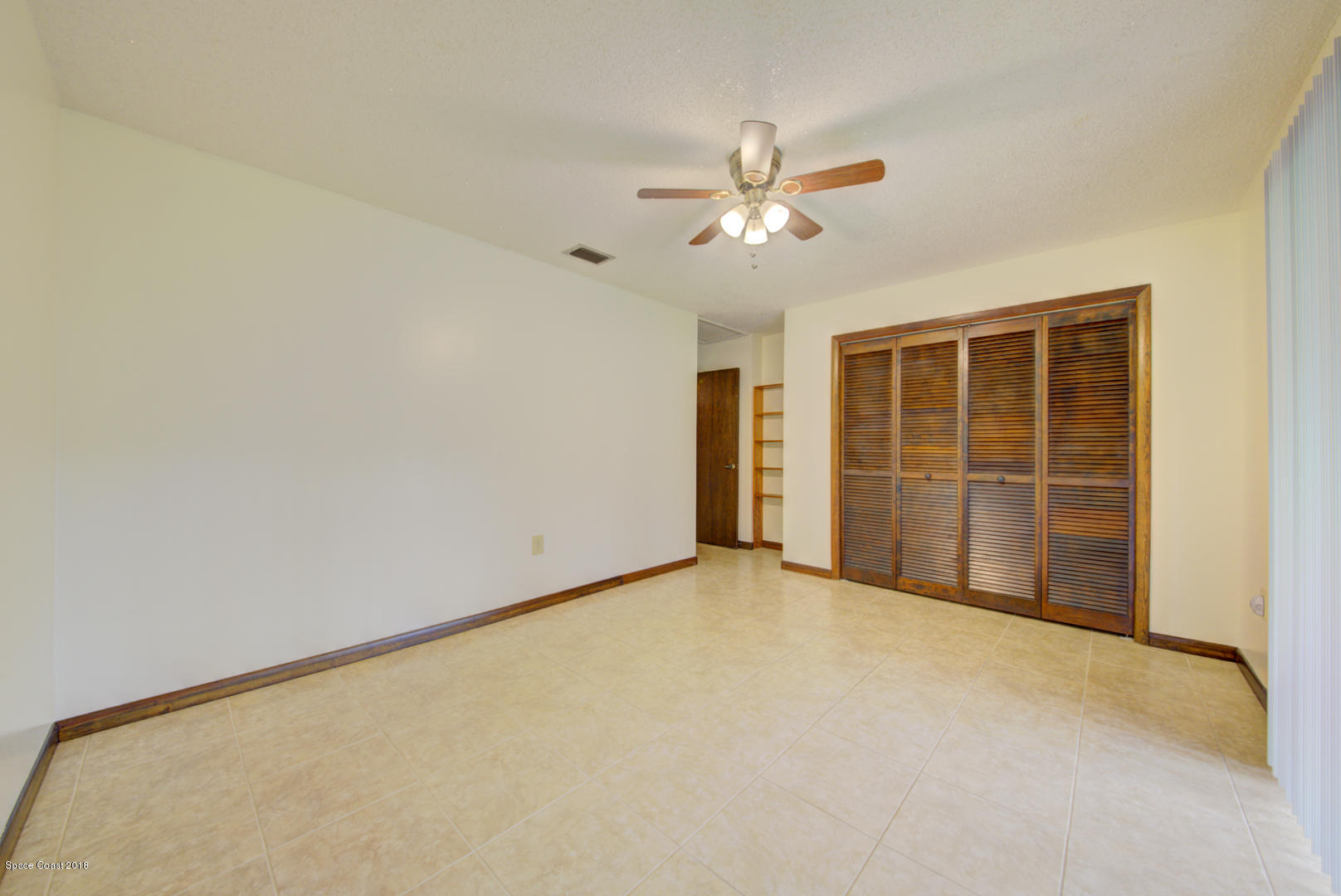 4660 Rector Road Cocoa, FL 32926 - Photo 43 of 56 bedroom 3 with built in shelves