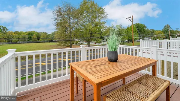 a view of a deck with a table and chairs