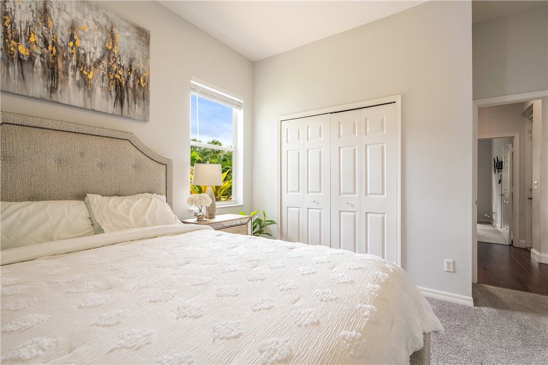 6425 33rd Lane Vero Beach, FL 32966 - Photo 22 of 29 a large white bed in a white room