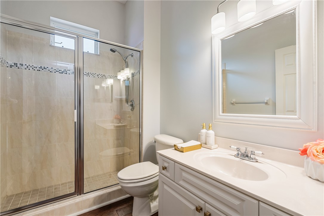 6425 33rd Lane Vero Beach, FL 32966 - Photo 23 of 29 a bathroom with a sink a toilet and shower
