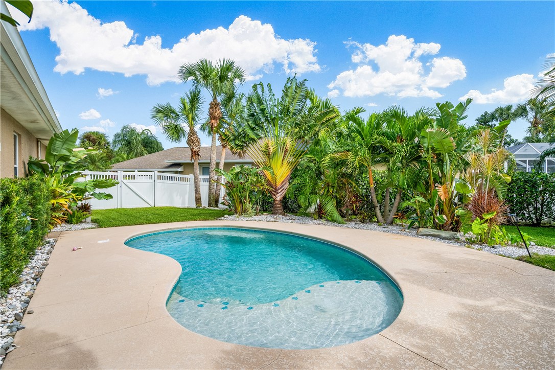 6425 33rd Lane Vero Beach, FL 32966 - Photo 5 of 29 a view of a swimming pool in a backyard