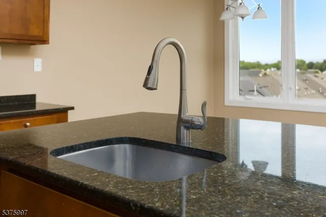 a kitchen with a sink and a window