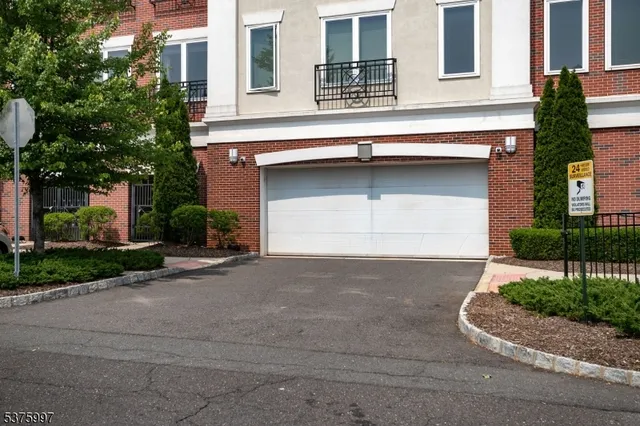 a front view of a house with garage