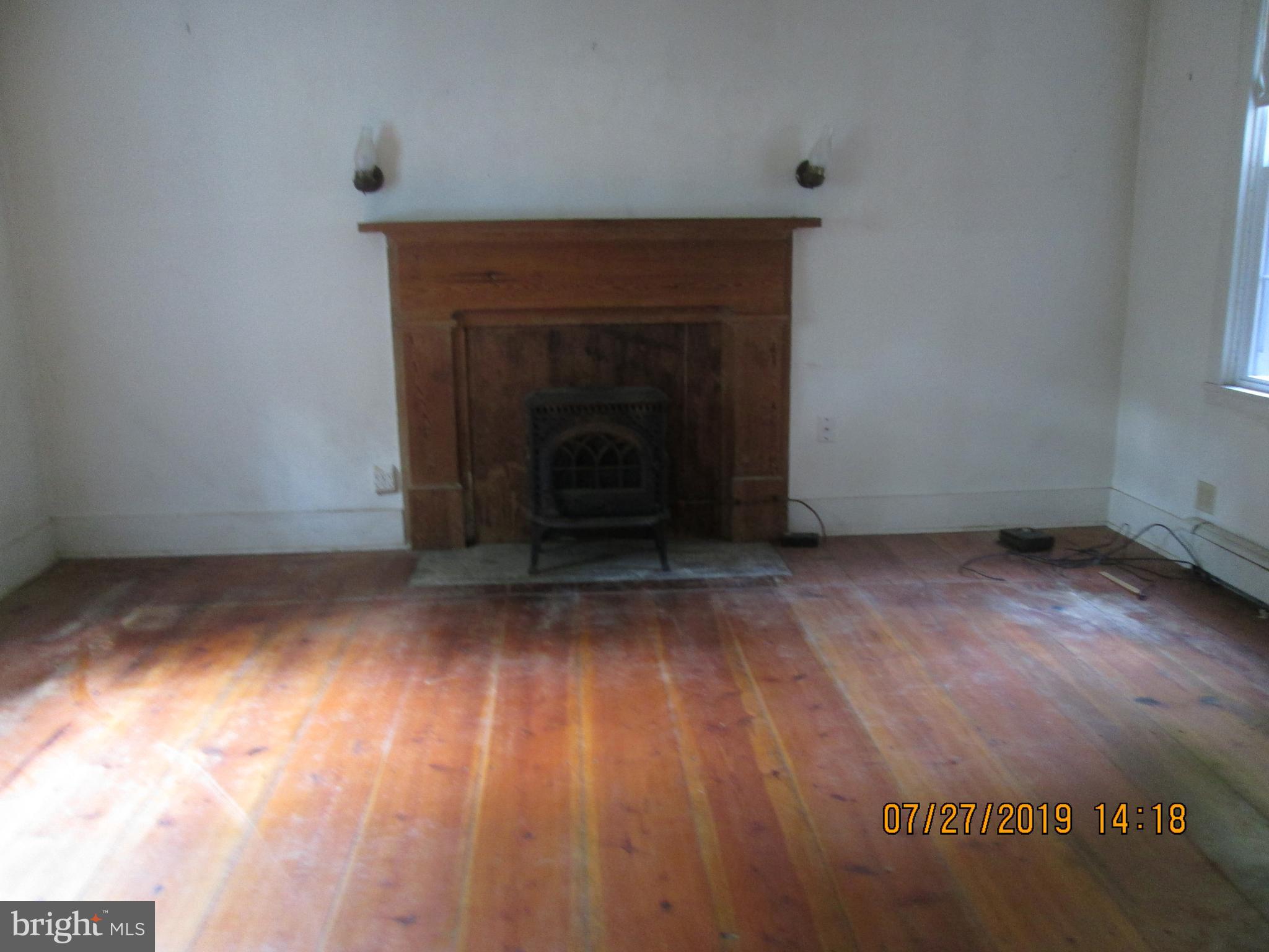 295 Hunters Road Gore, VA 22637 - Photo 7 of 16 Living room wih fireplace
