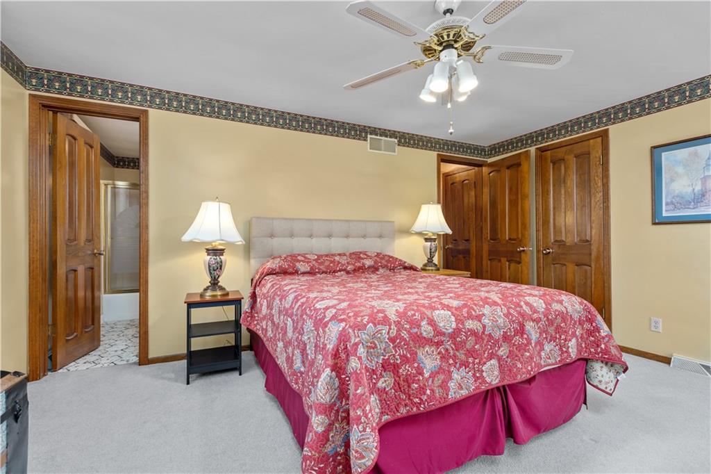 61 Meyers Road Washington, PA 15301 - Photo 15 of 23 a bedroom with a bed and a chandelier