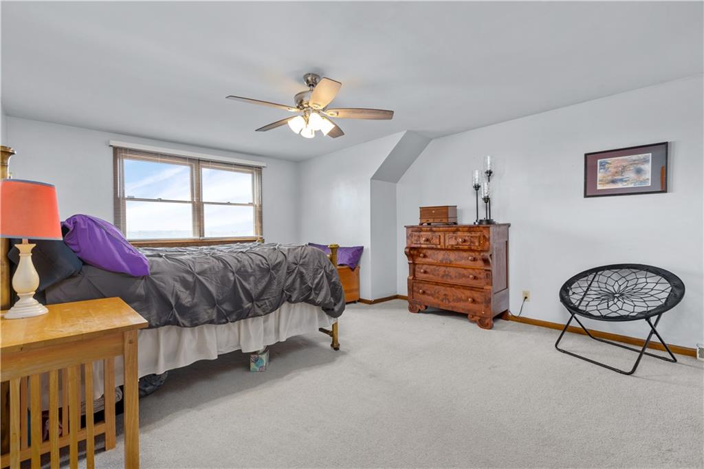 61 Meyers Road Washington, PA 15301 - Photo 17 of 23 a bedroom with a bed and a chandelier