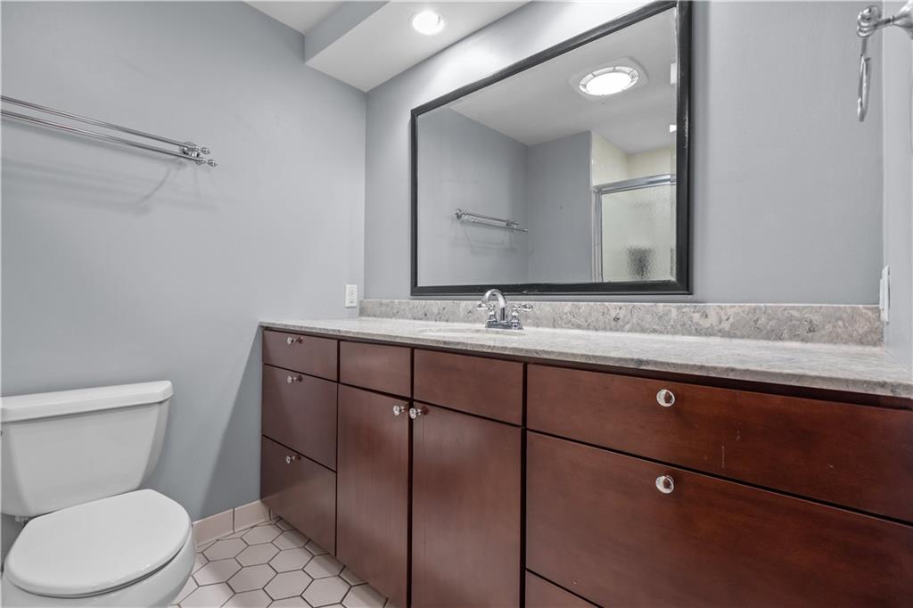 61 Meyers Road Washington, PA 15301 - Photo 18 of 23 a bathroom with a toilet sink and mirror