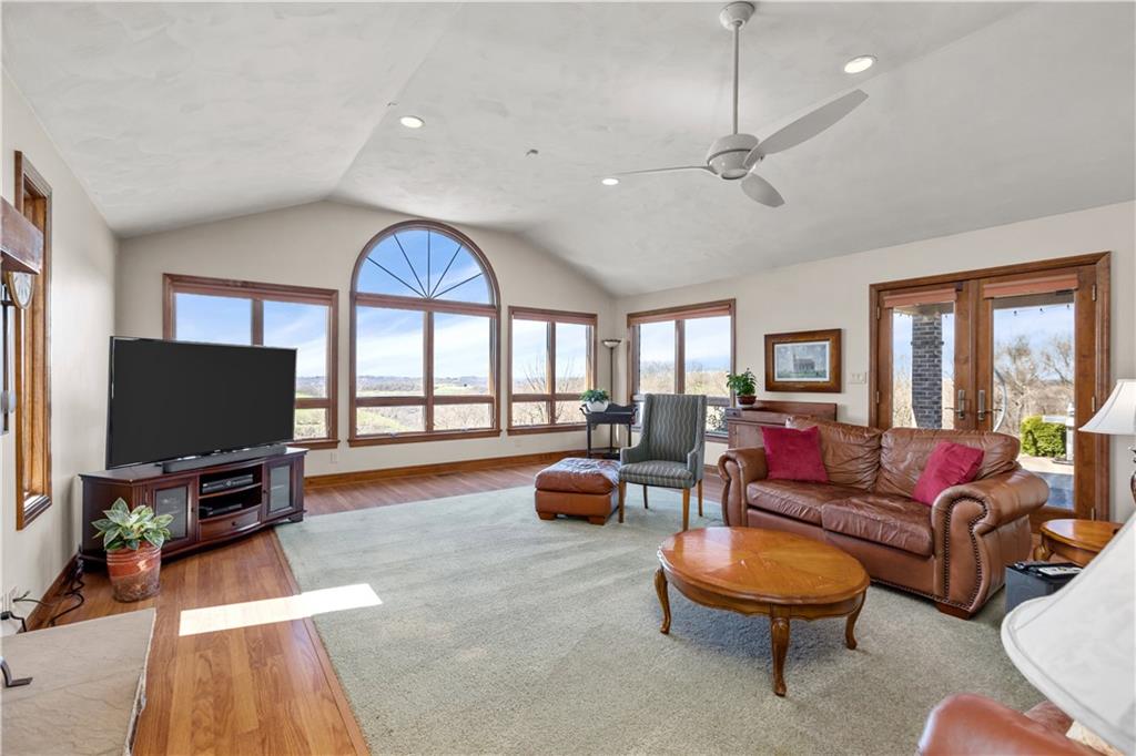 61 Meyers Road Washington, PA 15301 - Photo 3 of 23 a living room with furniture a flat screen tv and a floor to ceiling window