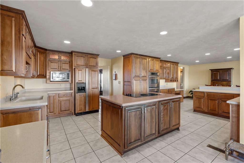 61 Meyers Road Washington, PA 15301 - Photo 8 of 23 a kitchen with stainless steel appliances a sink stove and cabinets