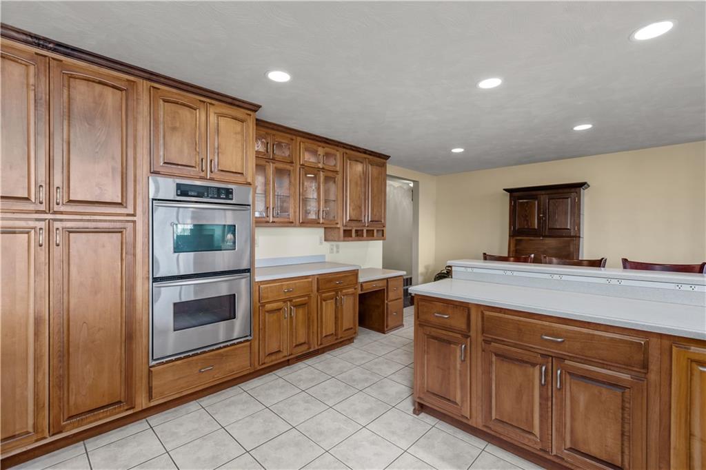 61 Meyers Road Washington, PA 15301 - Photo 10 of 23 a kitchen with stainless steel appliances granite countertop a stove a sink and a refrigerator