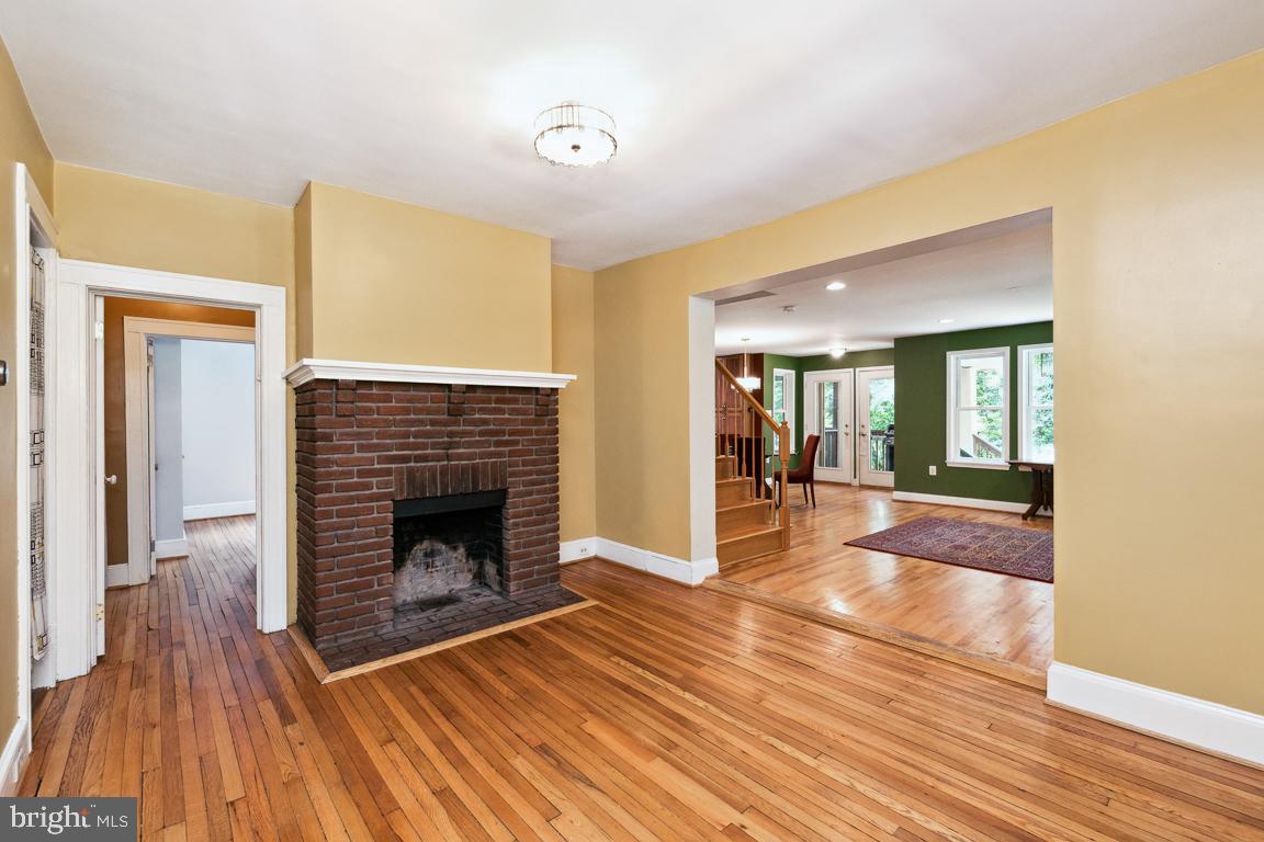 1813 Fairbank Road Baltimore, MD 21209 - Photo 13 of 65 Foyer with wood floors fireplace as is
