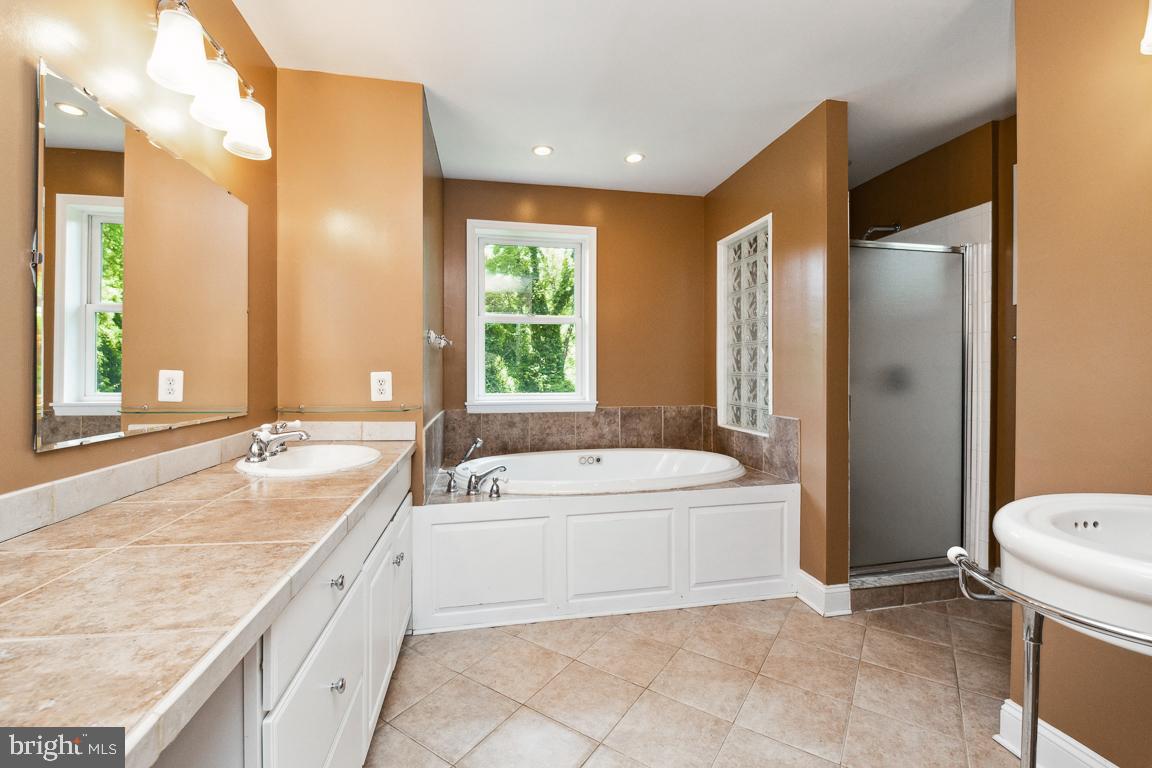 1813 Fairbank Road Baltimore, MD 21209 - Photo 36 of 65 Primary bath, vanity, soaking tub, separate shower
