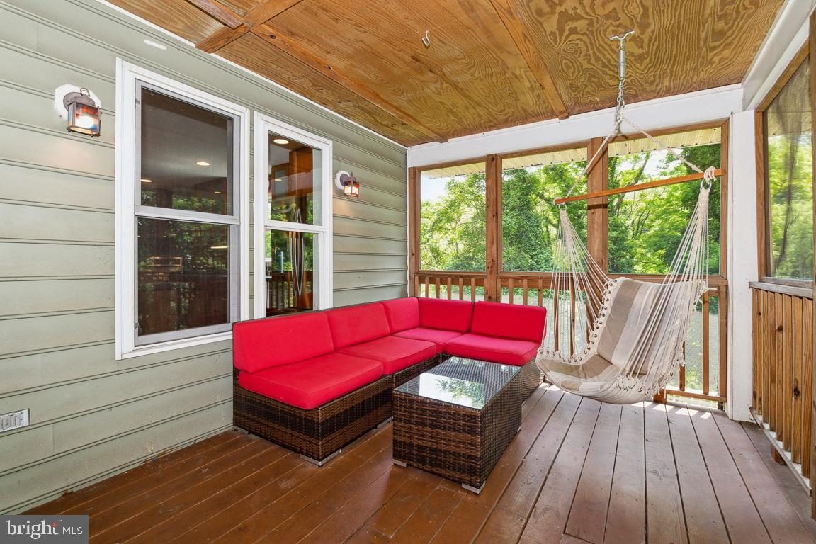 1813 Fairbank Road Baltimore, MD 21209 - Photo 53 of 65 Side screened porch off of the kitchen