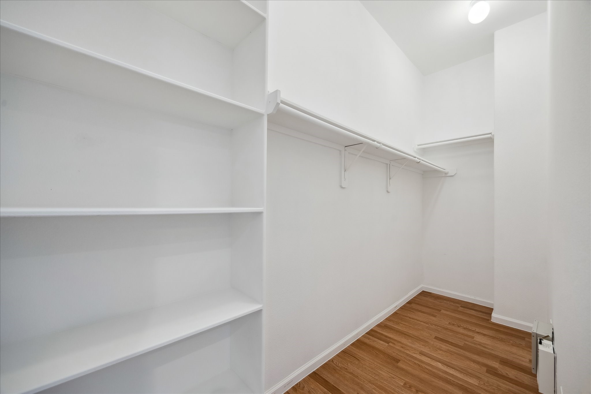 802 Waverly Street, Unit D Houston, TX 77007 - Photo 23 of 30 a view of small space with racks on the wall