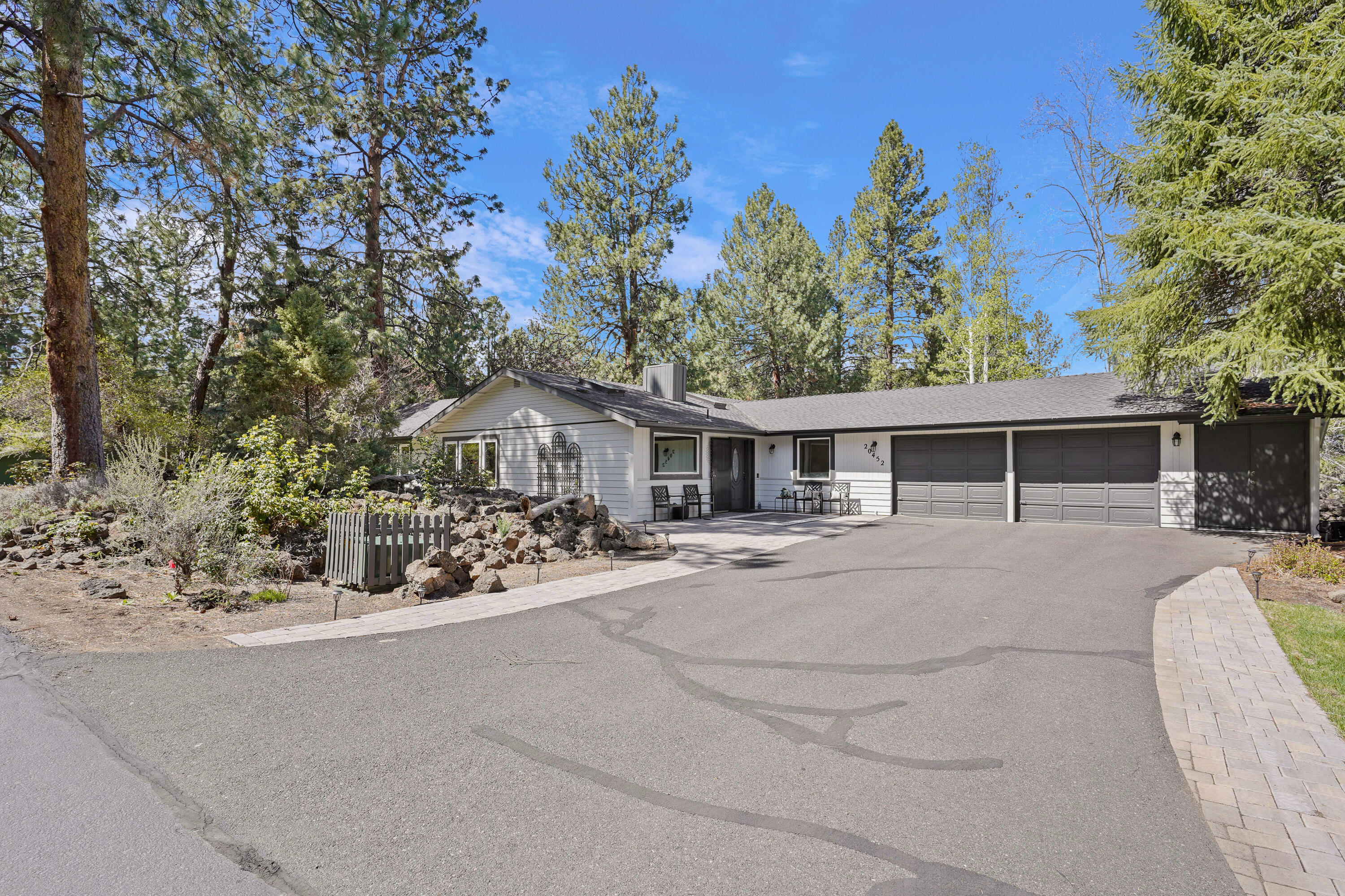 20452 Mainline Road Bend, OR 97702 - Photo 2 of 40 a view of a house with a yard and potted plants