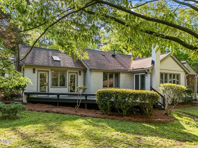 a view of a house with a yard porch and sitting area