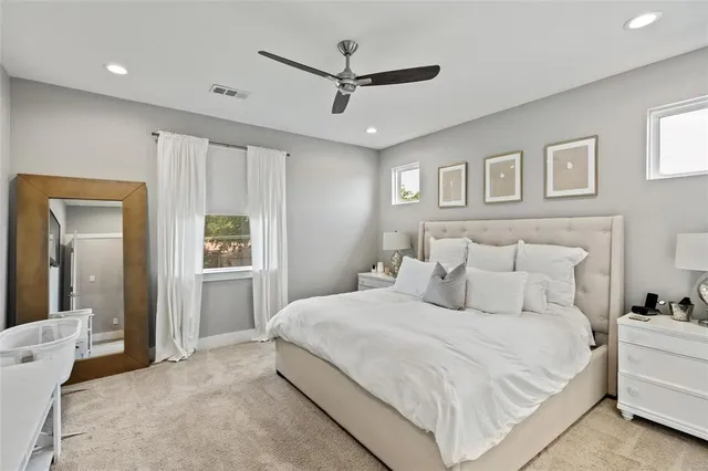 a bathroom with a sink vanity mirror and toilet