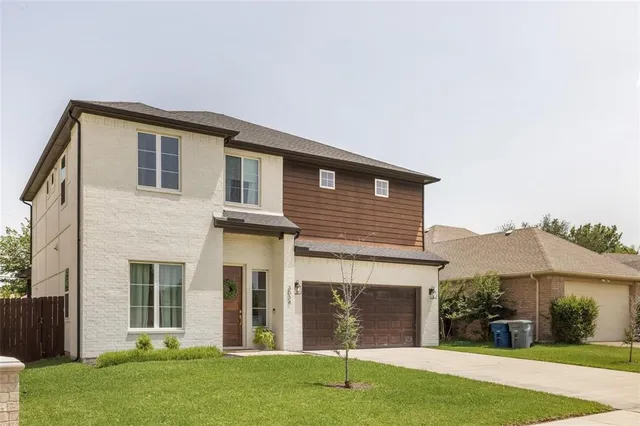 front view of a house with a yard