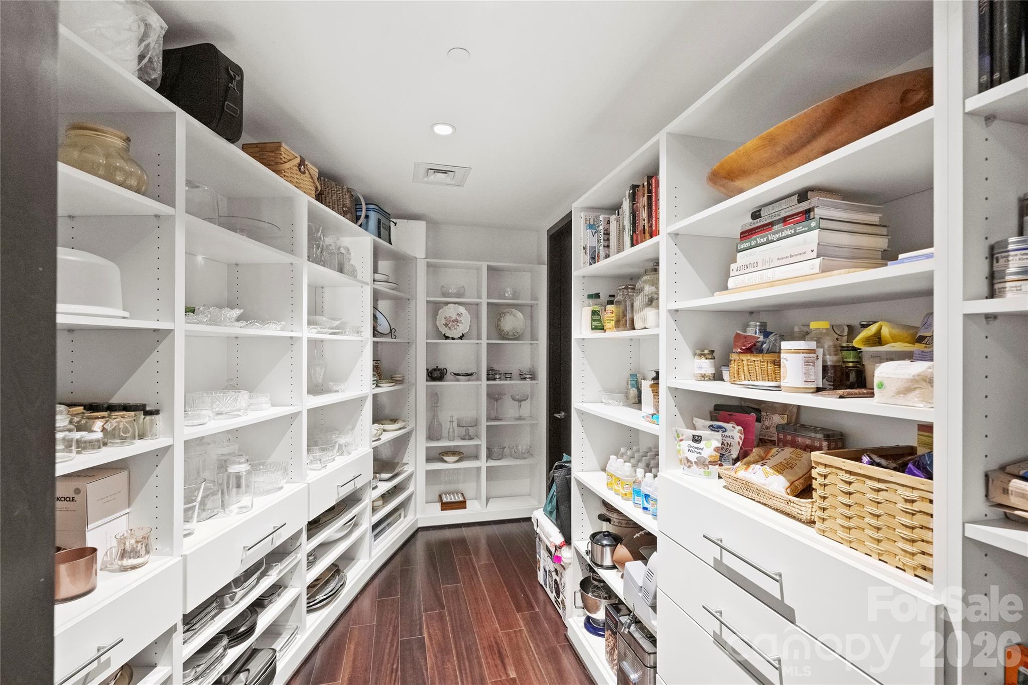 139 South Tryon Street, Unit 6 Charlotte, NC 28202 - Photo 21 of 47 a walk in closet with wooden floor