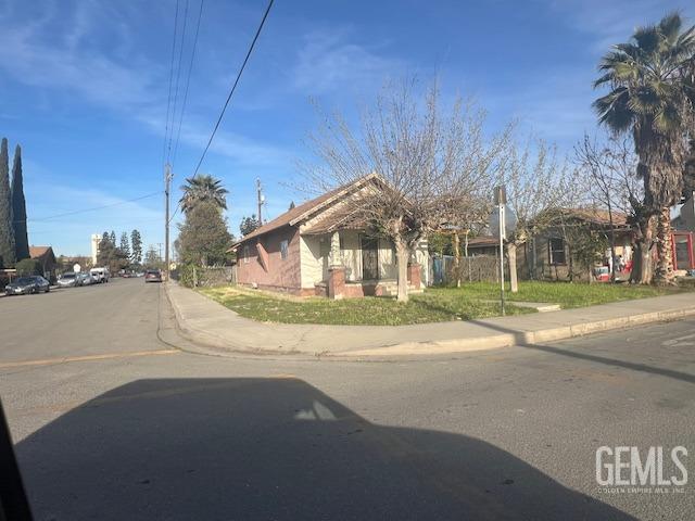 Undisclosed Address Wasco, CA 93280 - Photo 3 of 10 a view of road with yard