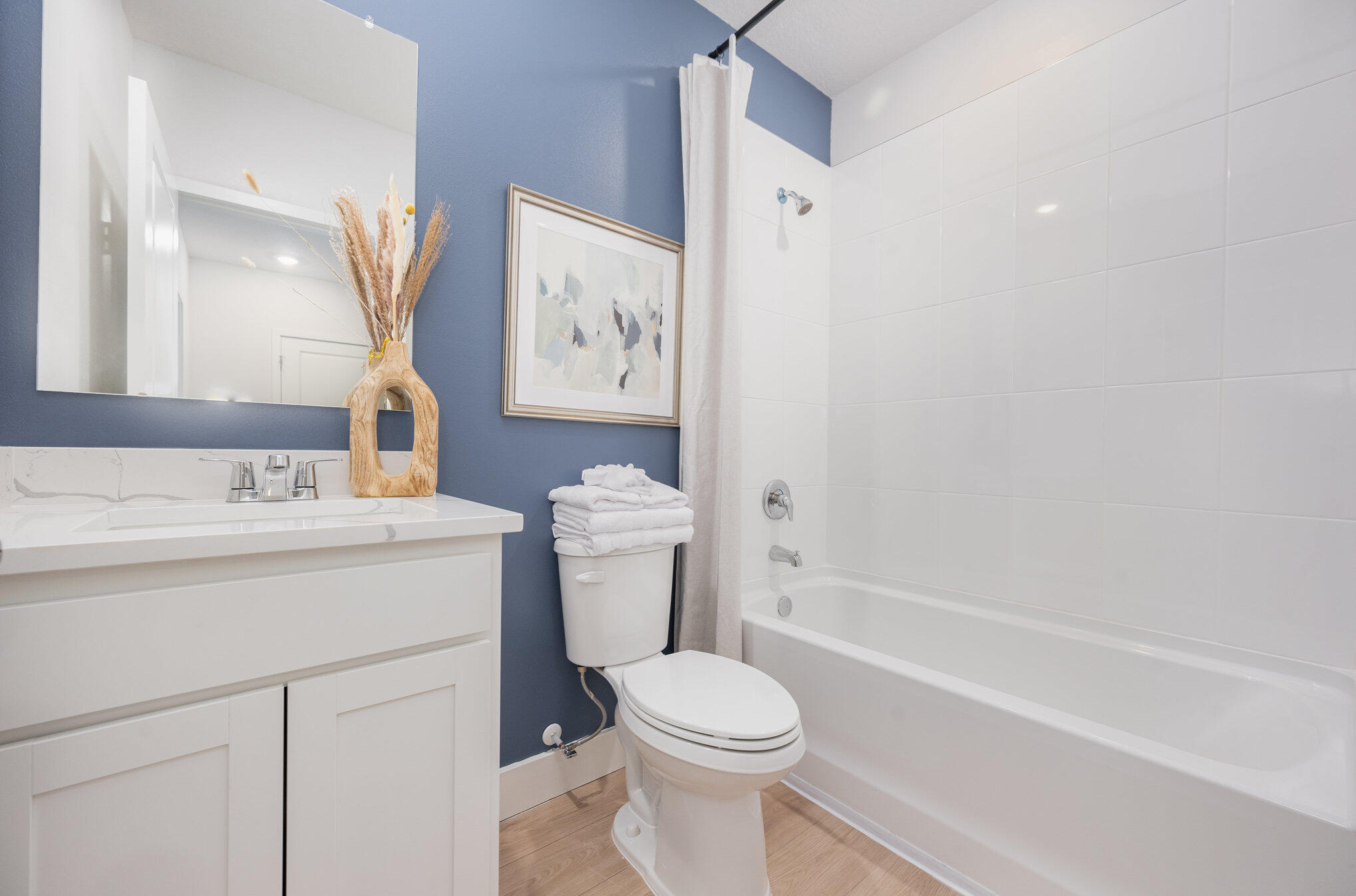 8160 Cobblestone Drive Fort Pierce, FL 34945 - Photo 11 of 17 a bathroom with a toilet sink and mirror
