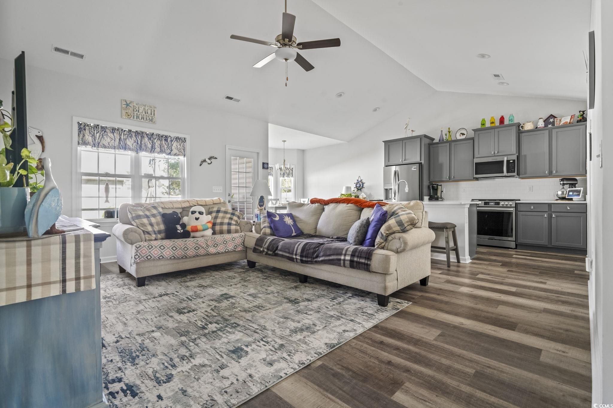 308 Concorde Drive Georgetown, SC 29440 - Photo 17 of 40 Living area with luxury vinyl plank floors, ceiling fan, and high vaulted ceiling