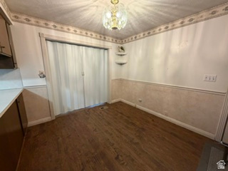 588 North 4500 West West Point, UT 84015 - Photo 13 of 61 Dining area featuring wood-finish flooring, a decorative border, and chair rail molding