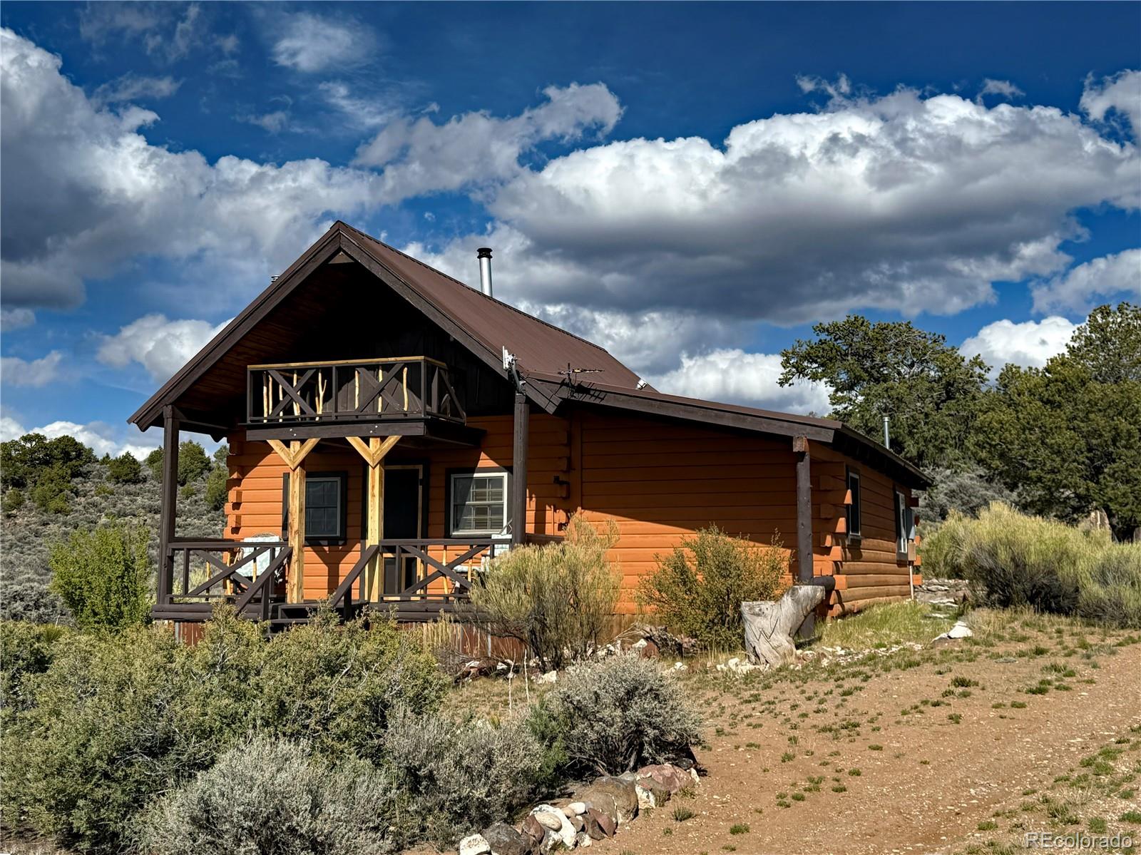 6132 Running Horse Road San Luis, CO 81152 - Photo 1 of 45 a front view of a house with a yard