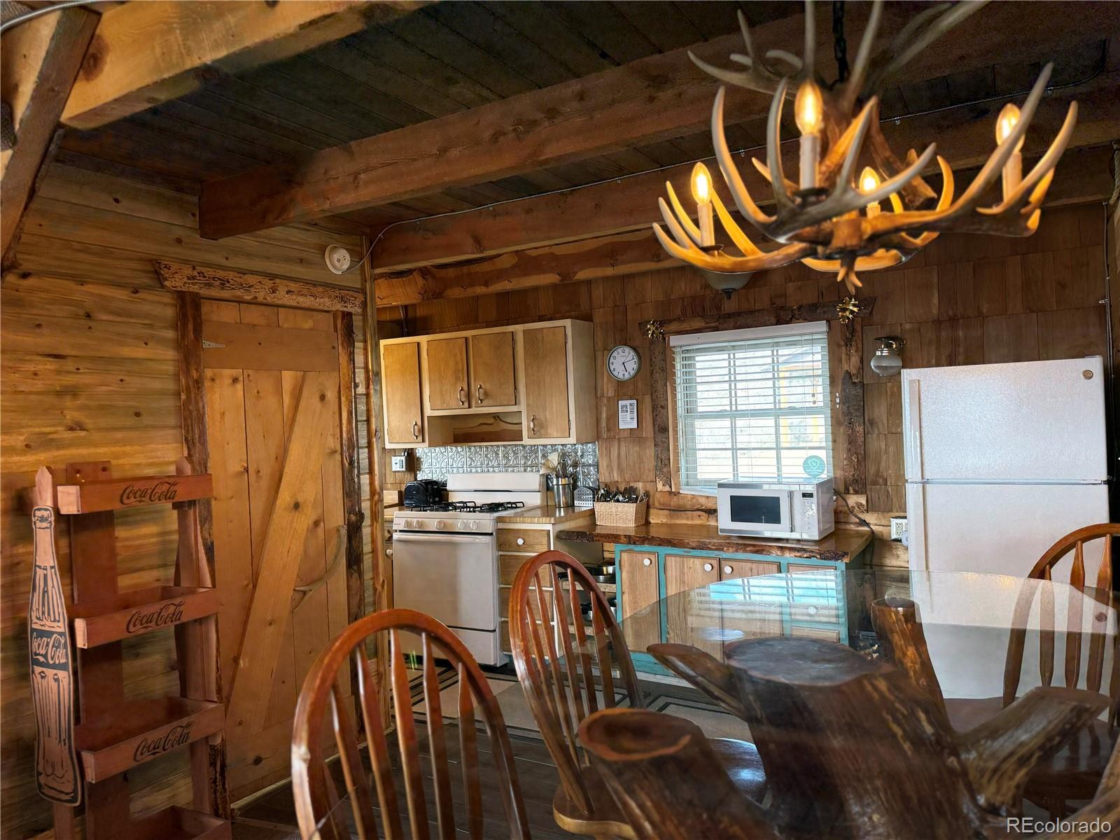 6132 Running Horse Road San Luis, CO 81152 - Photo 13 of 45 a view of a dining room with furniture window and outside view