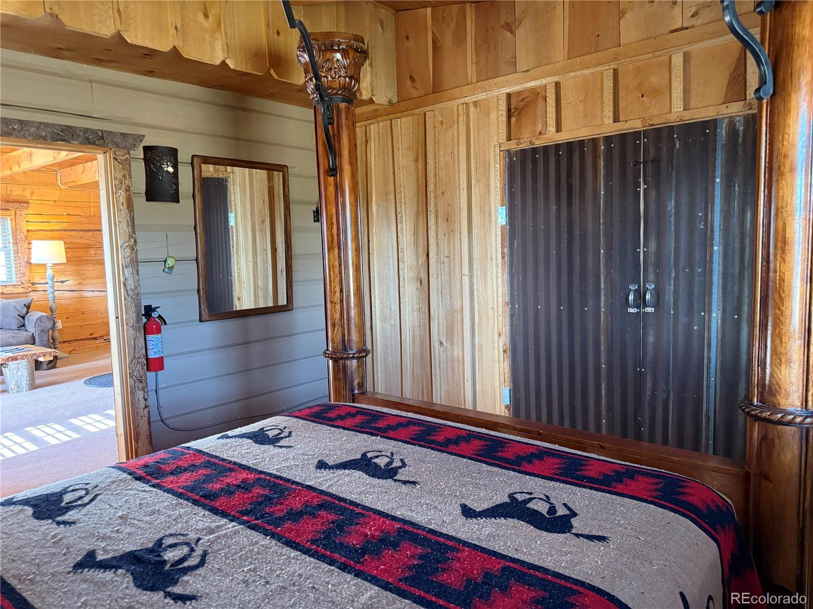 6132 Running Horse Road San Luis, CO 81152 - Photo 21 of 45 a room with a bed and a dresser