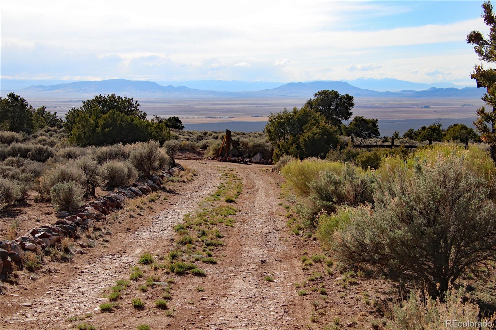 6132 Running Horse Road San Luis, CO 81152 - Photo 29 of 45 a view of a beach in front of a house
