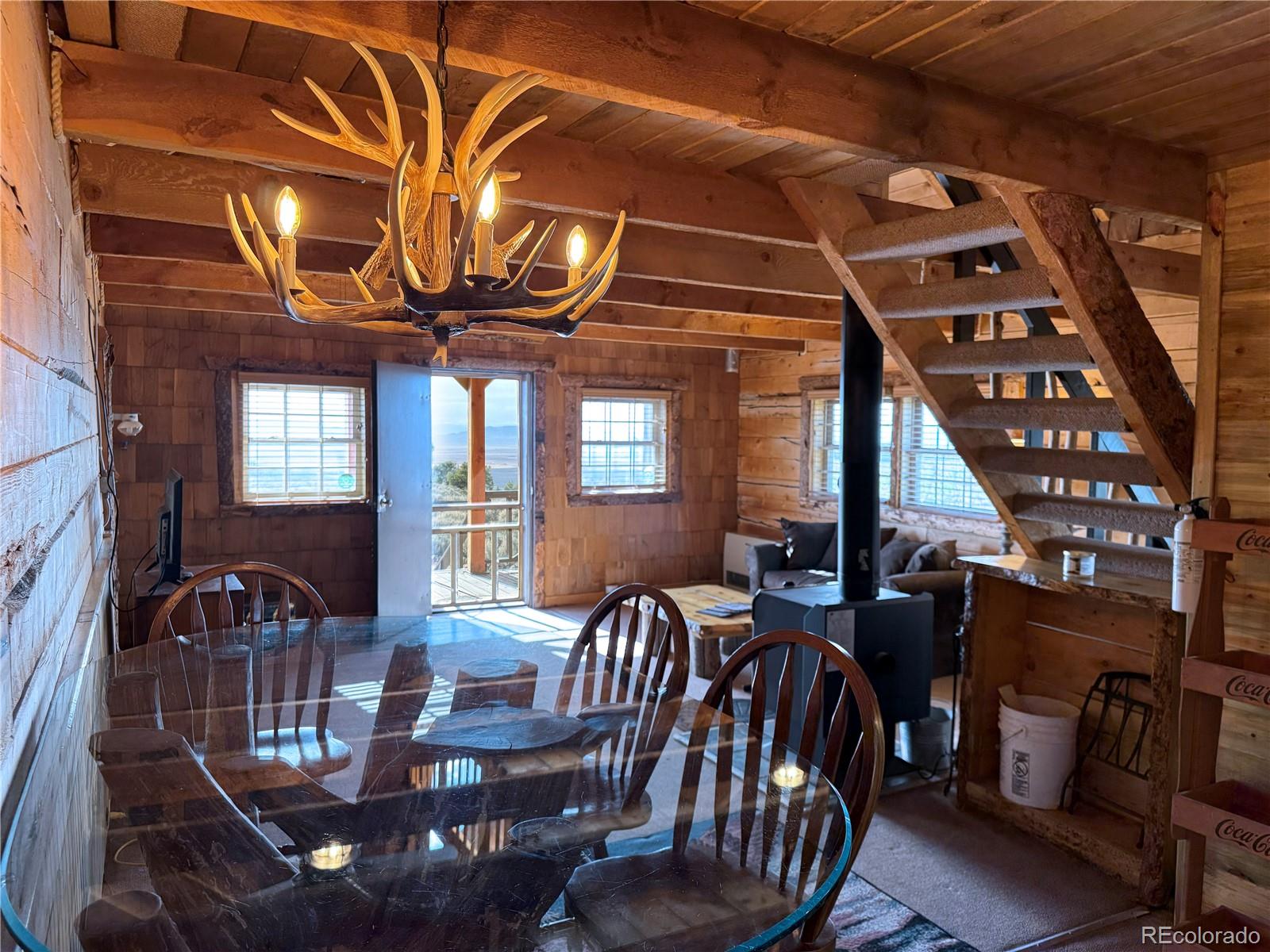 6132 Running Horse Road San Luis, CO 81152 - Photo 10 of 45 a view of a dining room with furniture and chandelier