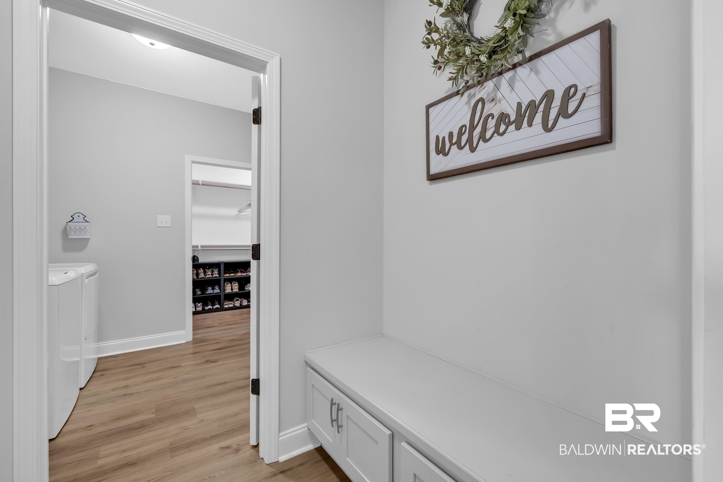 1176 Stella Road Foley, AL 36535 - Photo 23 of 40 Mudroom with light wood finished floors and washer and dryer