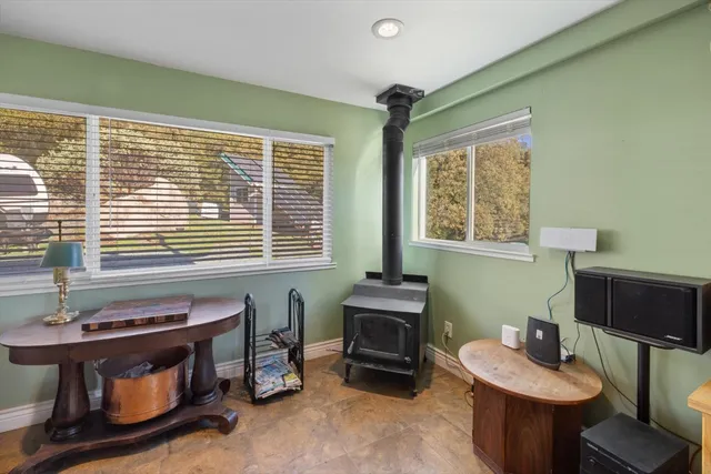 a room with wooden floor and furniture