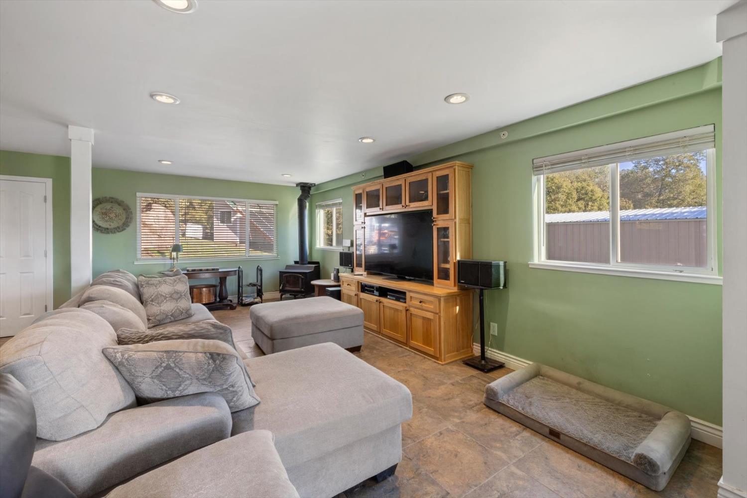 2870 Sand Ridge Road Placerville, CA 95667 - Photo 16 of 91 a living room with furniture and a flat screen tv