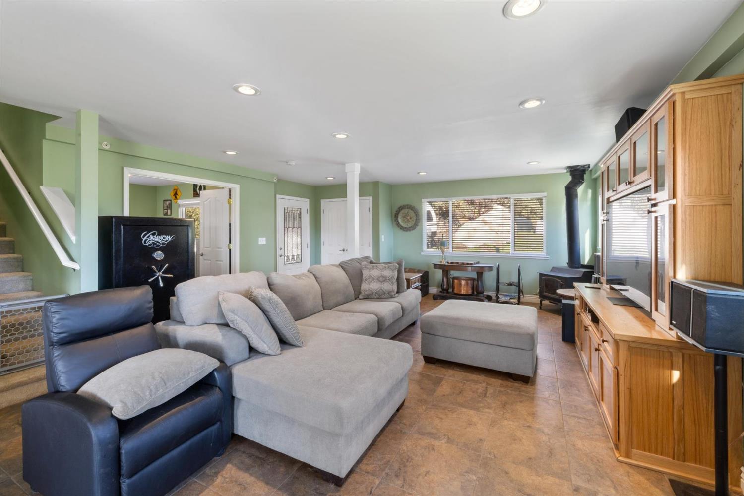 2870 Sand Ridge Road Placerville, CA 95667 - Photo 17 of 91 a living room with furniture flat screen tv and a window