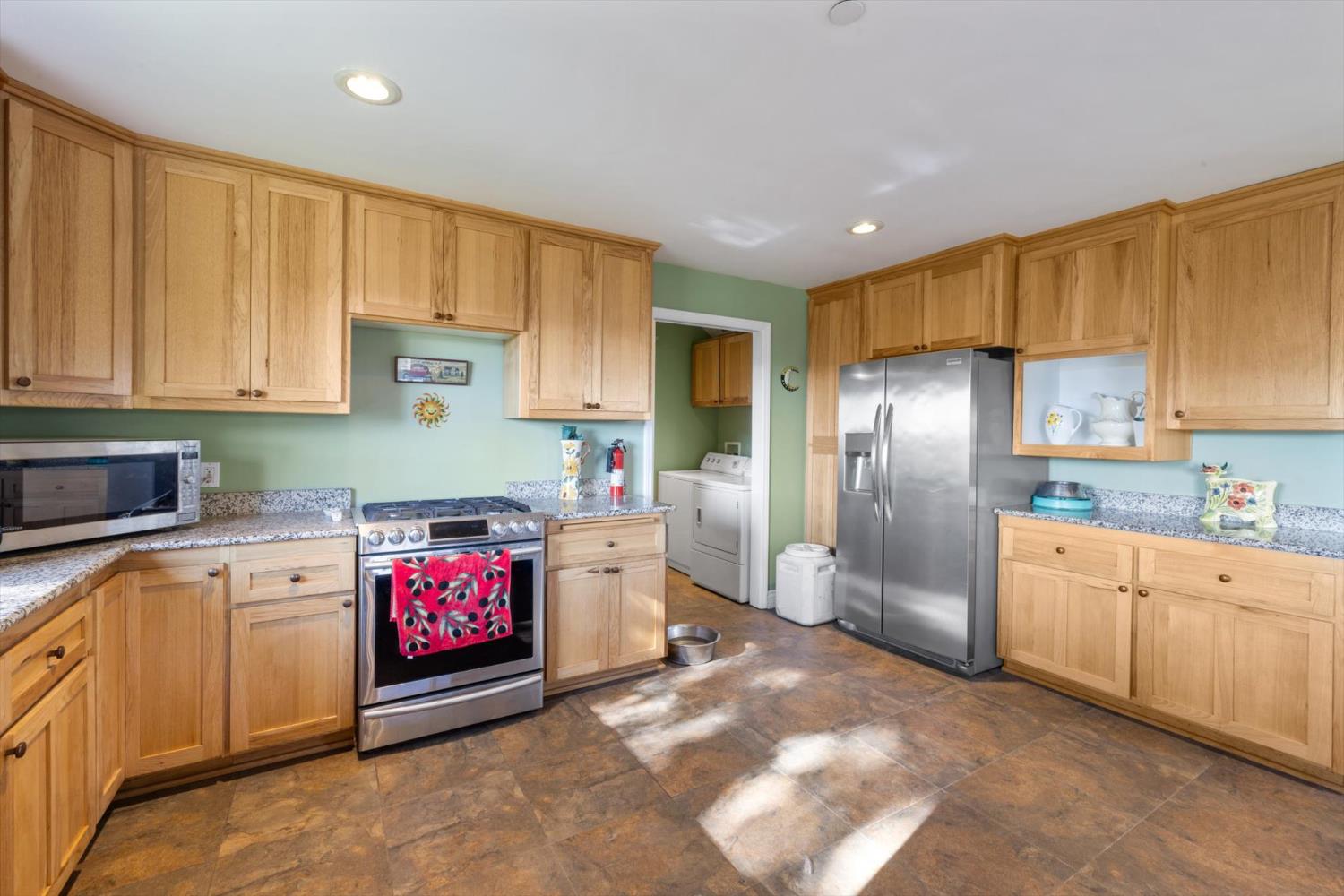 2870 Sand Ridge Road Placerville, CA 95667 - Photo 25 of 91 a kitchen with stainless steel appliances granite countertop a refrigerator sink and cabinets