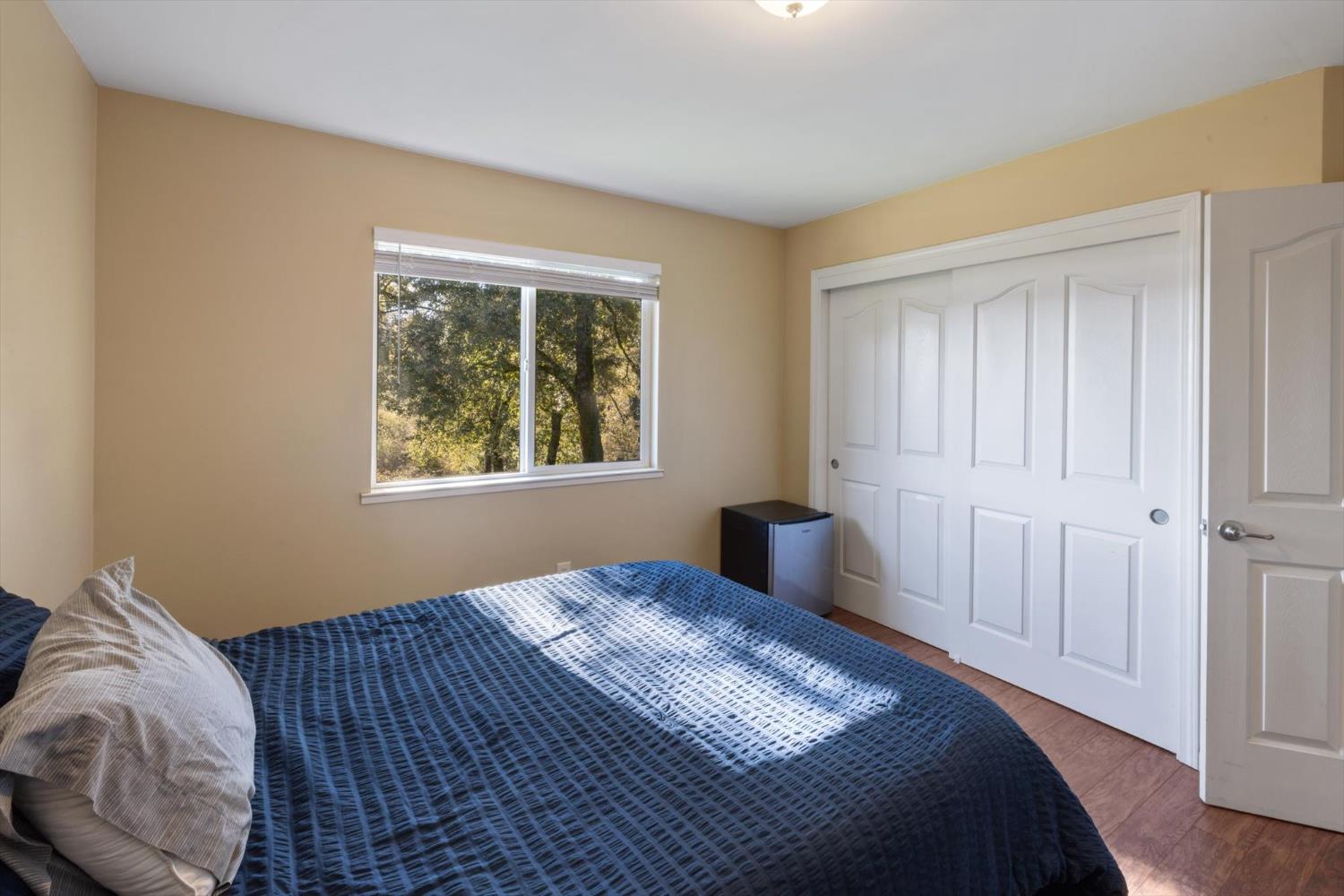 2870 Sand Ridge Road Placerville, CA 95667 - Photo 32 of 91 a bedroom with a bed and a window