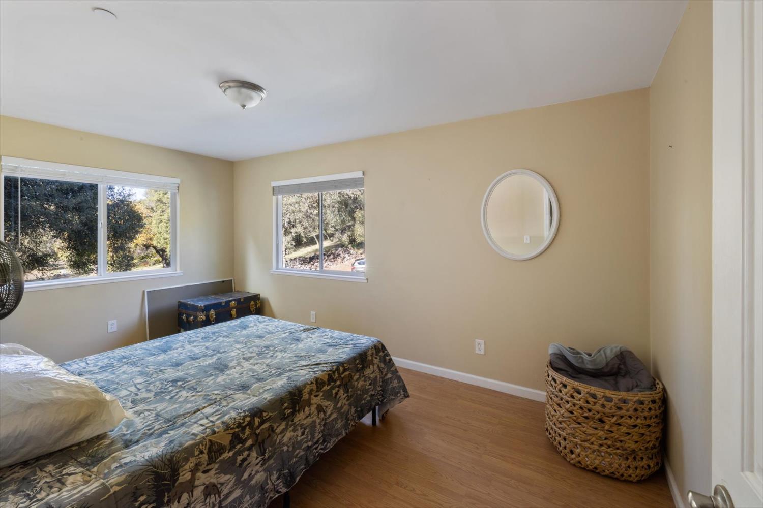 2870 Sand Ridge Road Placerville, CA 95667 - Photo 34 of 91 a bedroom with a bed and window with chair