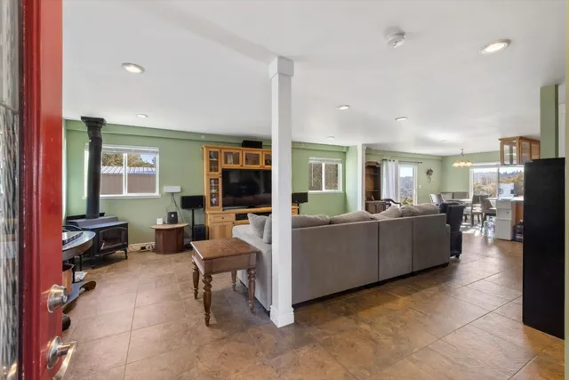 a kitchen with stainless steel appliances granite countertop a refrigerator sink and cabinets