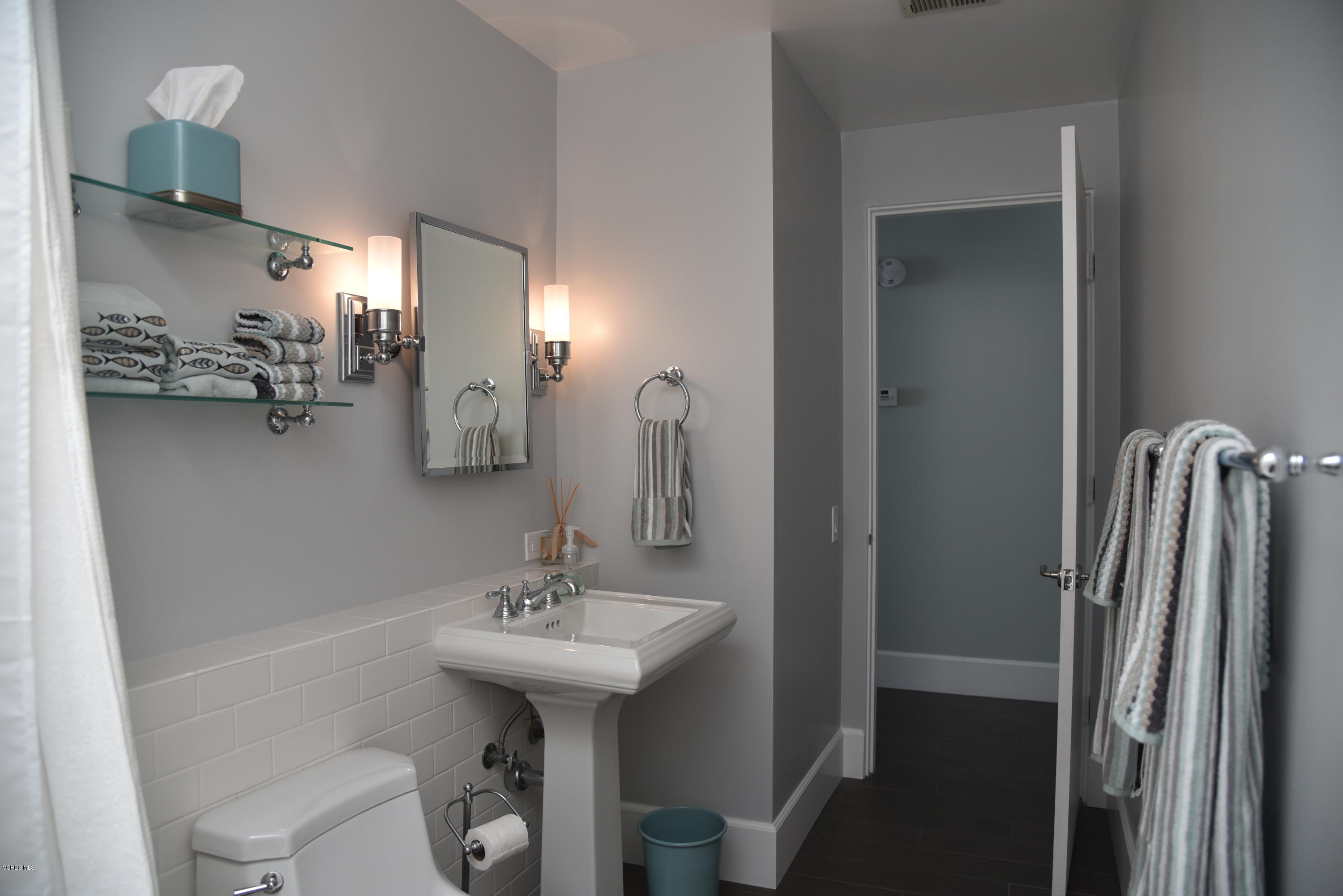 4885 Sandyland Road, Unit 2 Carpinteria, CA 93013 - Photo 28 of 39 a bathroom with a sink toilet and shower