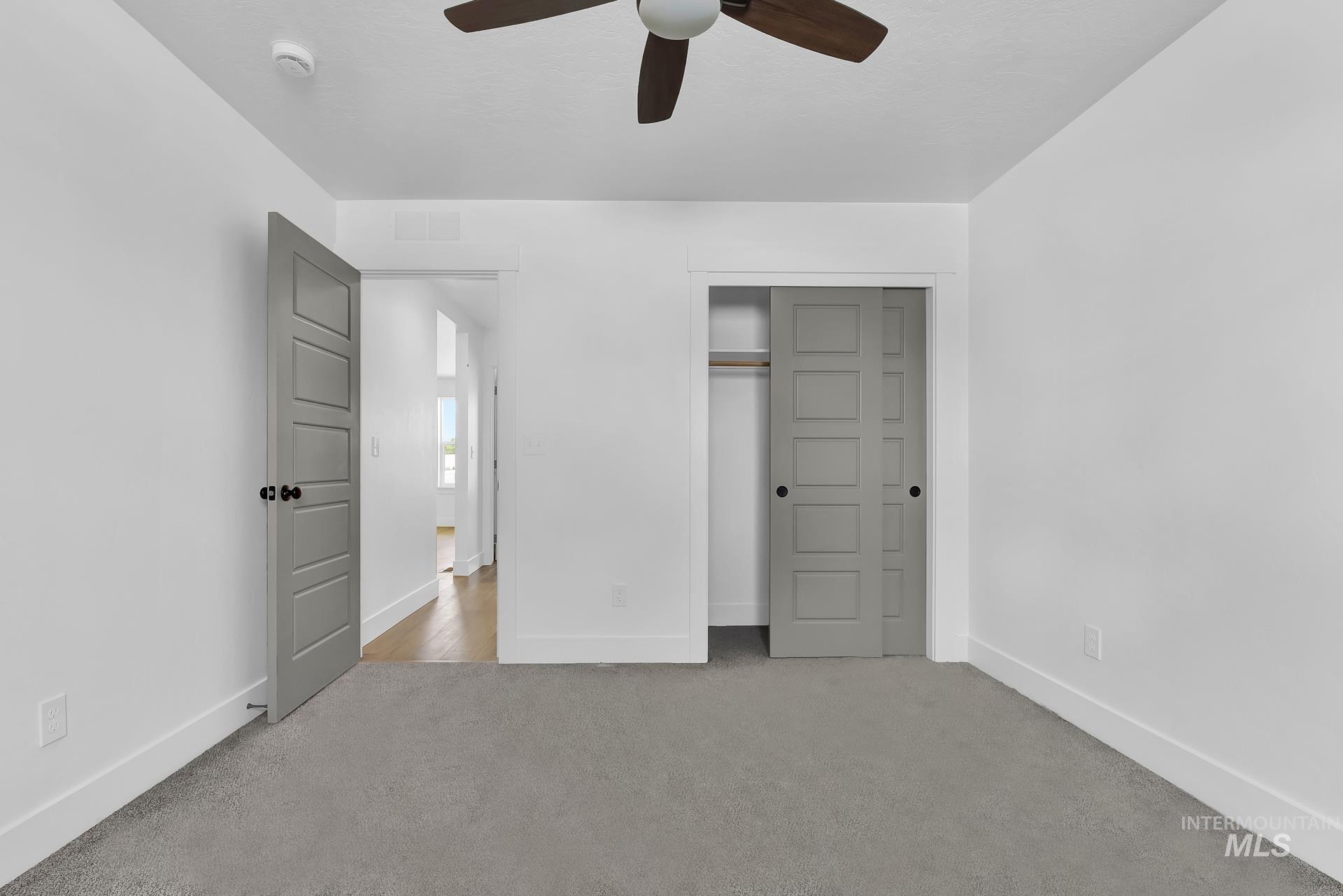 1160 Velvet Loop Wilder, ID 83676 - Photo 20 of 29 Unfurnished bedroom featuring carpet floors, a closet, and ceiling fan