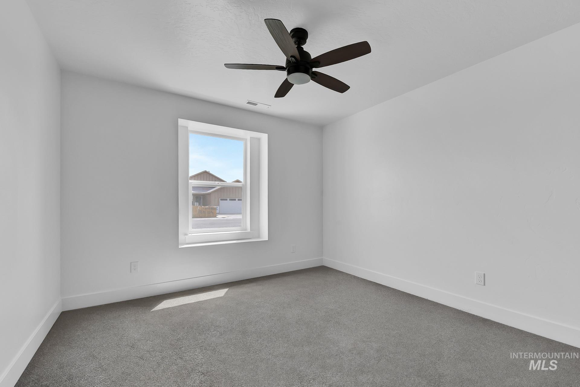 1160 Velvet Loop Wilder, ID 83676 - Photo 22 of 29 Carpeted spare room with baseboards and a ceiling fan