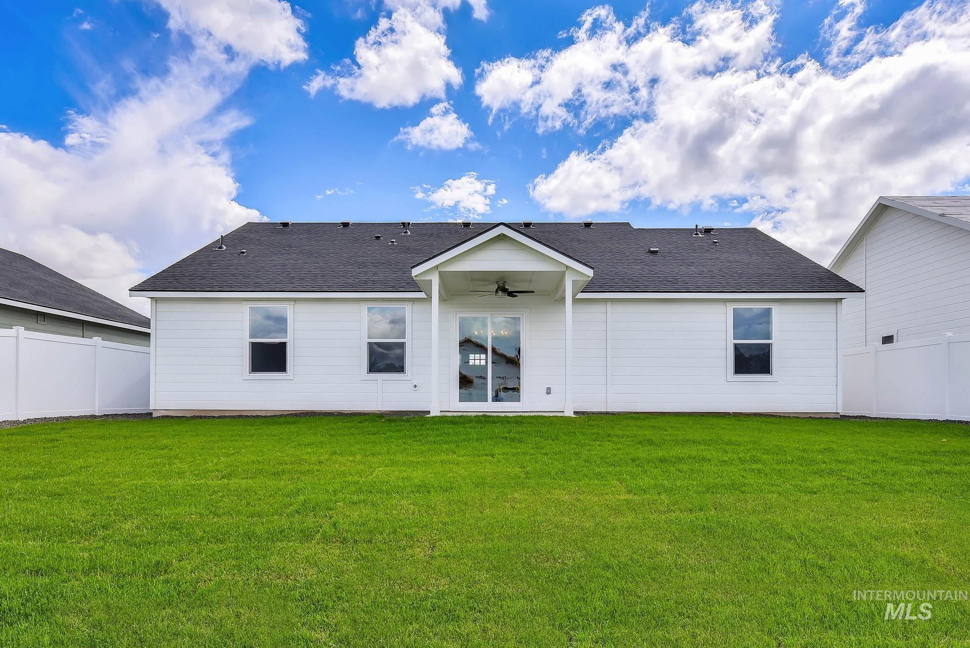 1160 Velvet Loop Wilder, ID 83676 - Photo 26 of 29 Back of property with a shingled roof, ceiling fan, and a patio area